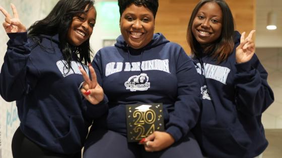ODU alumnae Jordyn Harrell, left, and Jasmyn Harrell flank their mother Celeste Harrell, a current ODU student who is scheduled to graduate in May 2023.