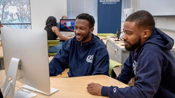 Students working on online cybersecurity courses